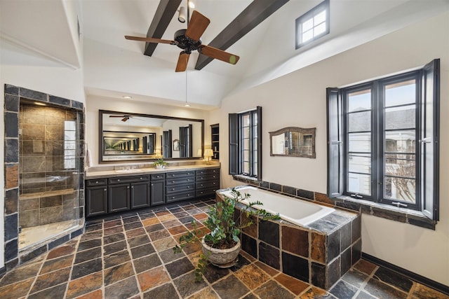 bathroom featuring independent shower and bath, vanity, and high vaulted ceiling