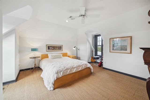 bedroom featuring lofted ceiling, light carpet, and ceiling fan