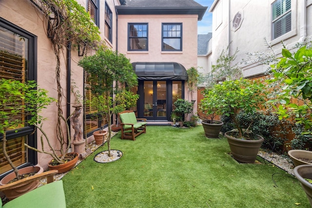 view of yard featuring french doors