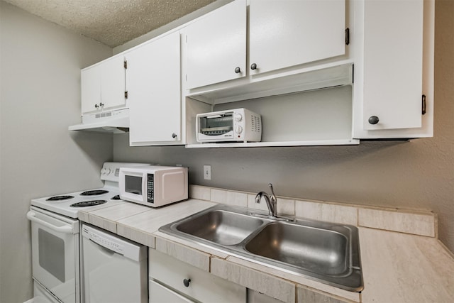 kitchen featuring sink, a textured ceiling, white cabinets, and white appliances