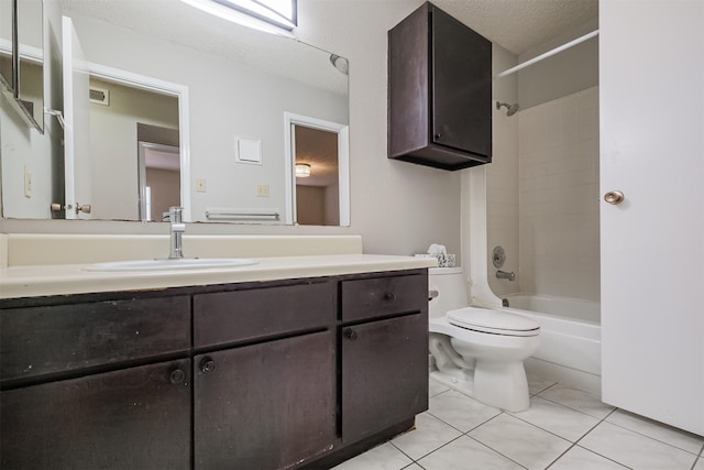 full bathroom with tile patterned flooring, vanity, shower / bathing tub combination, a textured ceiling, and toilet