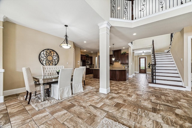 dining room featuring ornate columns