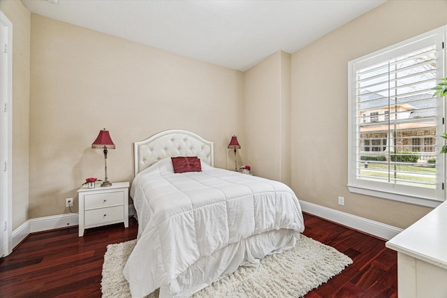 bedroom featuring dark hardwood / wood-style flooring