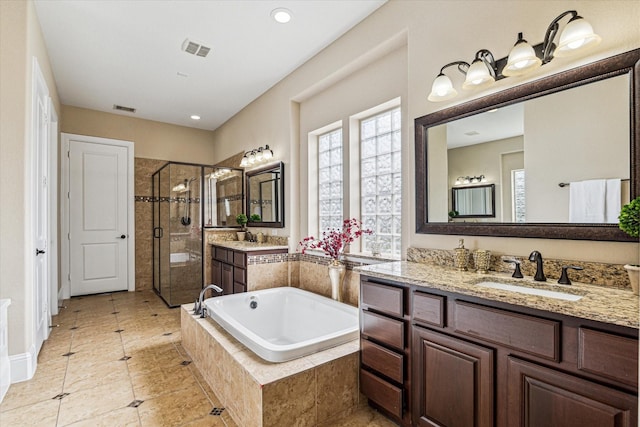 bathroom featuring vanity and plus walk in shower