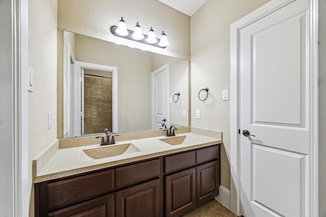 bathroom with vanity and tile patterned floors