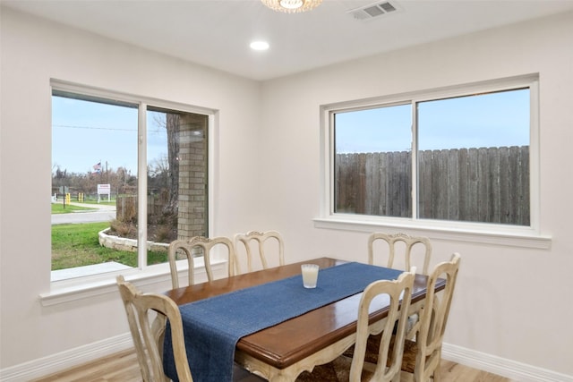 dining area with light hardwood / wood-style floors