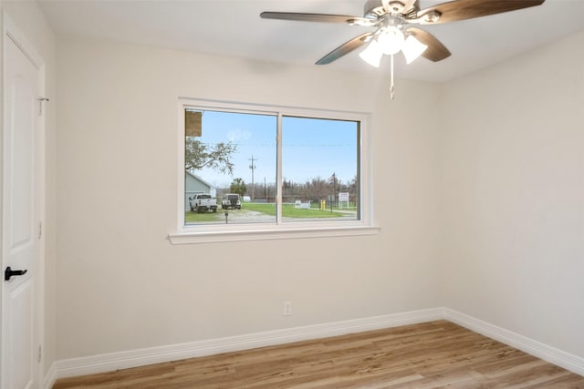 empty room featuring light hardwood / wood-style flooring and ceiling fan