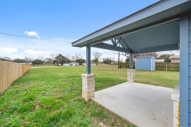 view of yard with a patio area and a storage unit
