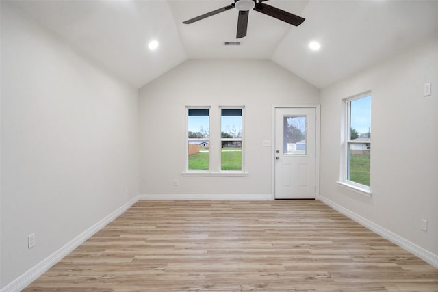 unfurnished living room featuring ceiling fan, lofted ceiling, and light hardwood / wood-style floors