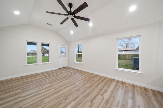 unfurnished room with vaulted ceiling, light hardwood / wood-style floors, and ceiling fan