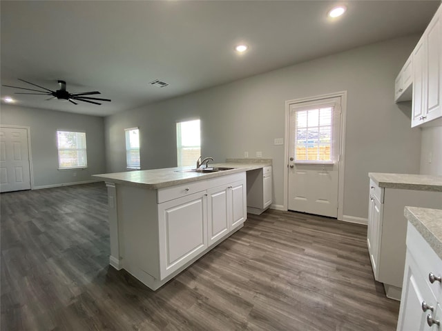 kitchen featuring white cabinetry, sink, ceiling fan, and dark hardwood / wood-style flooring