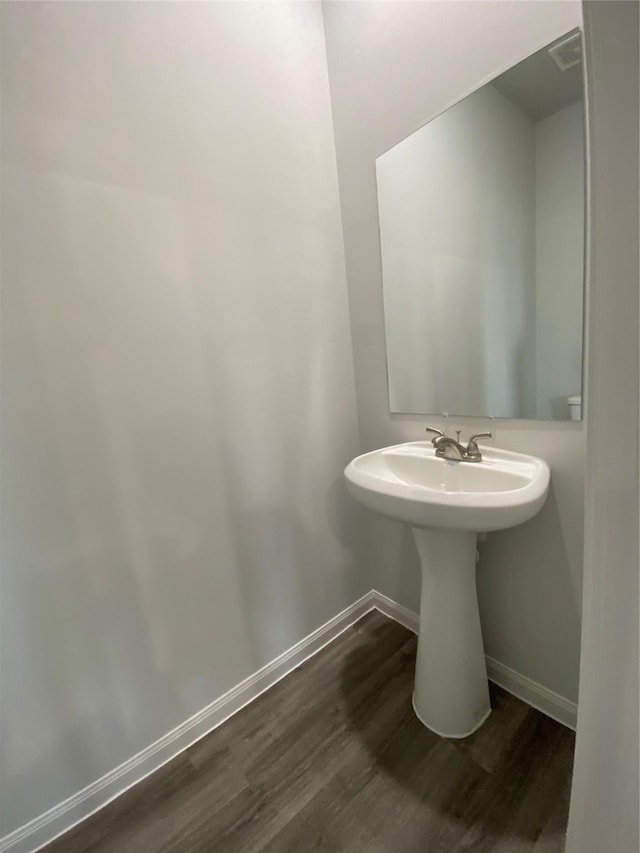 bathroom featuring wood-type flooring