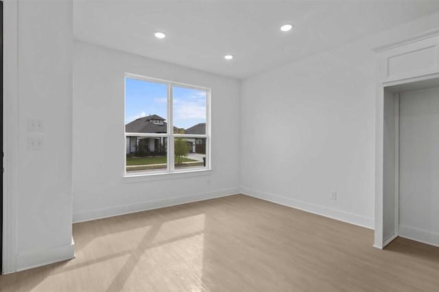 unfurnished bedroom with light wood-type flooring