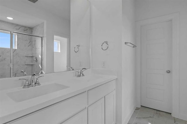 bathroom with vanity and an enclosed shower