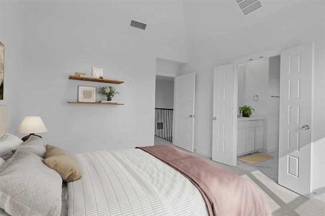 bedroom with light colored carpet