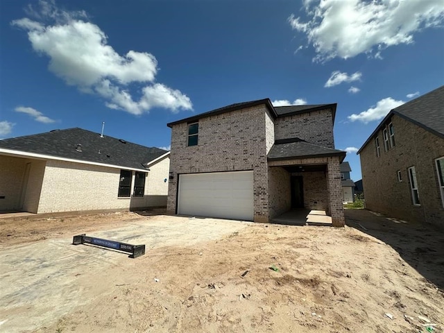 3318 Verdant, Richmond, TX 77406 - rear view of house with brick siding, an attached garage, and driveway