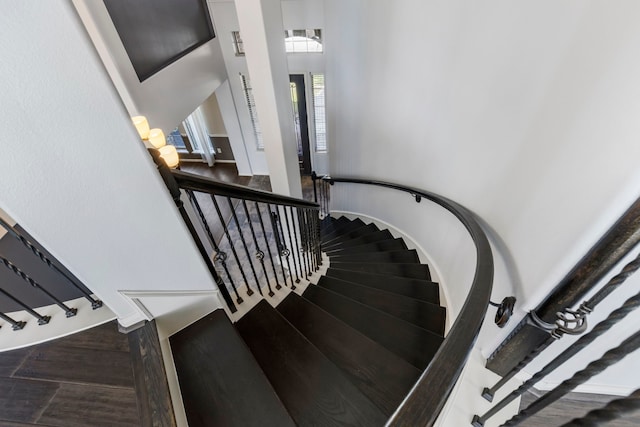 stairs featuring hardwood / wood-style floors