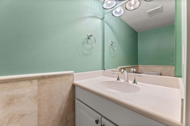 bathroom with visible vents and vanity