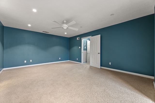 empty room featuring recessed lighting, carpet flooring, visible vents, baseboards, and a ceiling fan