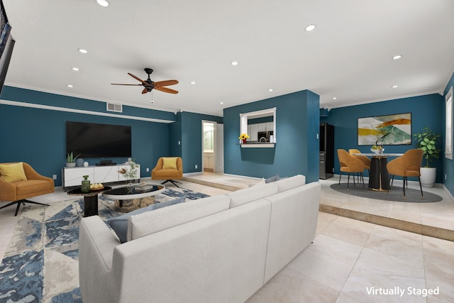 living area with baseboards, visible vents, a ceiling fan, crown molding, and recessed lighting