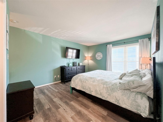 bedroom with wood-type flooring