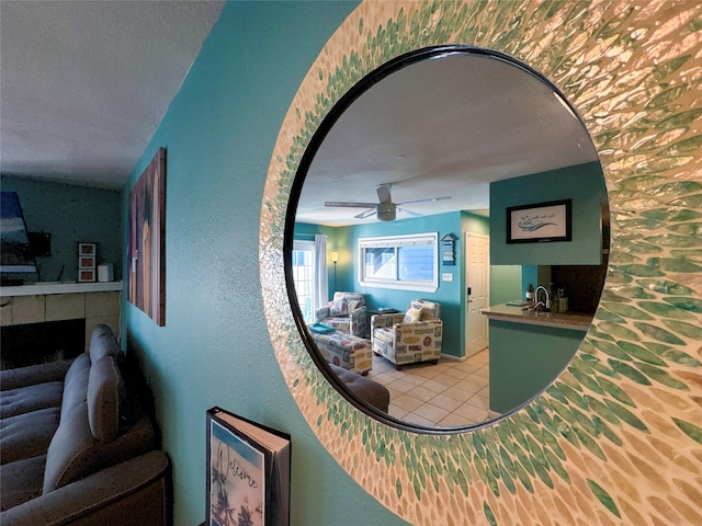 hall with sink and a textured ceiling