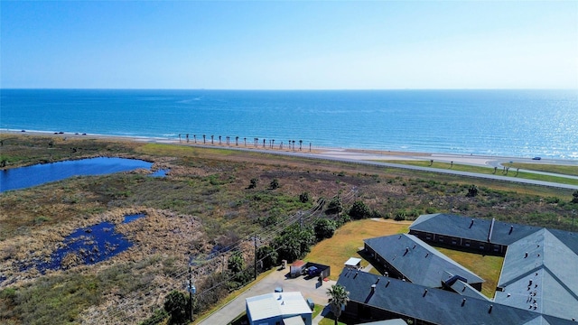 bird's eye view with a water view and a view of the beach