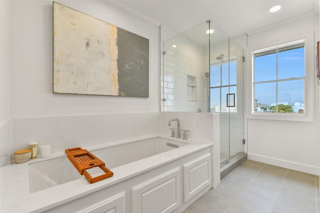 bathroom with ornamental molding, tile patterned floors, and shower with separate bathtub