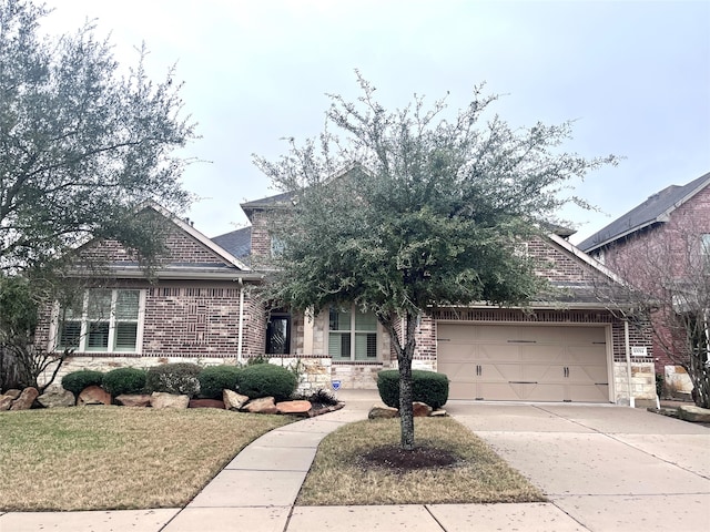 view of front of home featuring a garage and a front lawn