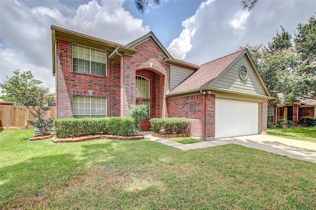 view of front of property featuring a garage and a front yard