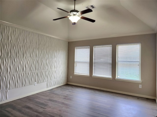 spare room featuring ceiling fan, vaulted ceiling, hardwood / wood-style floors, and a wealth of natural light