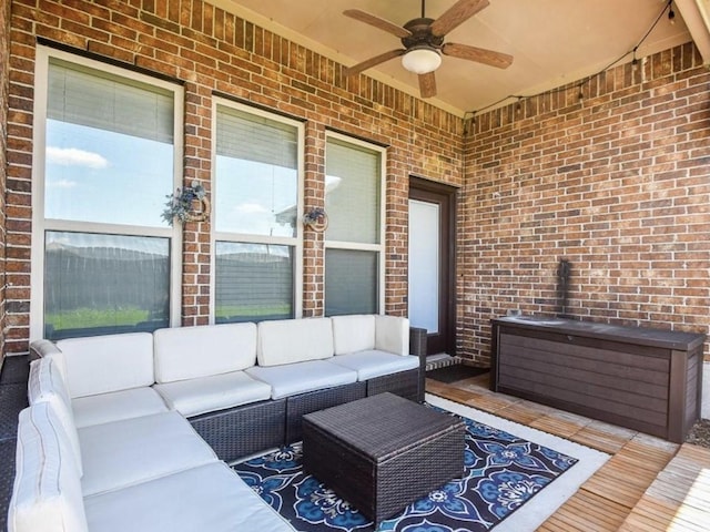 exterior space featuring an outdoor hangout area and ceiling fan