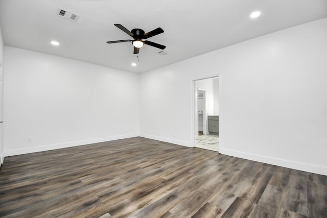 empty room featuring dark hardwood / wood-style floors and ceiling fan