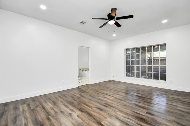 empty room featuring hardwood / wood-style flooring and ceiling fan