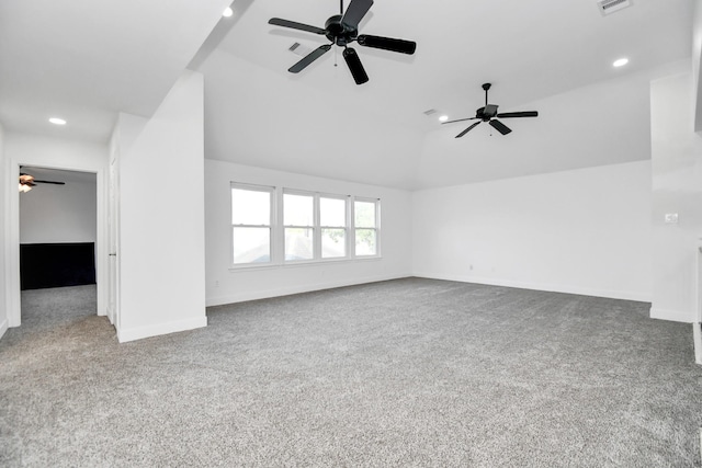 unfurnished living room featuring lofted ceiling and carpet floors