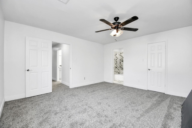 unfurnished bedroom with ceiling fan, connected bathroom, and carpet