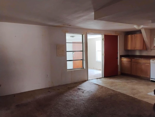 kitchen with dark countertops and brown cabinets