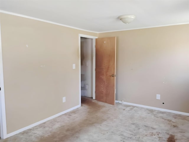 empty room with light carpet, crown molding, and baseboards