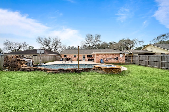 rear view of property with a patio area and a lawn