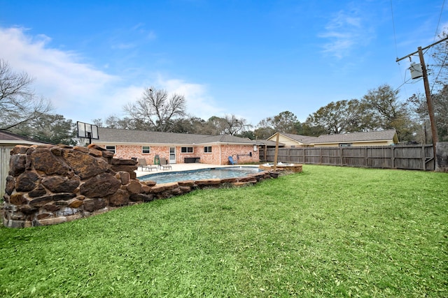 view of yard with a fenced in pool and a patio area