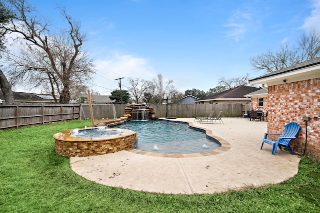 view of swimming pool featuring pool water feature, a yard, an in ground hot tub, and a patio