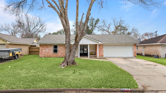 single story home with brick siding, fence, a garage, driveway, and a front lawn