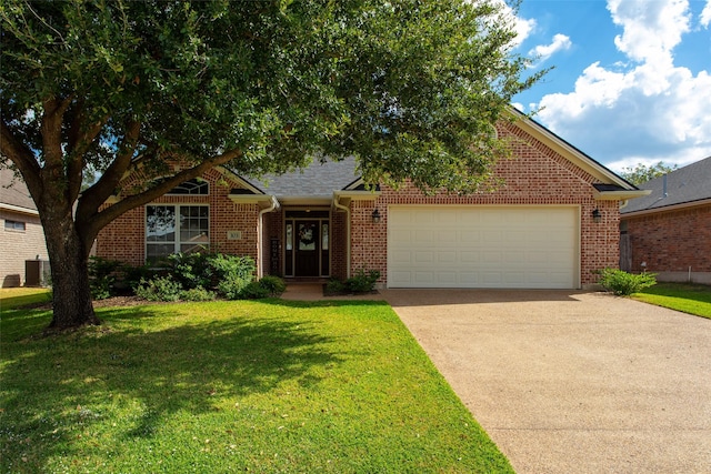 view of front of home with cooling unit, a garage, and a front yard