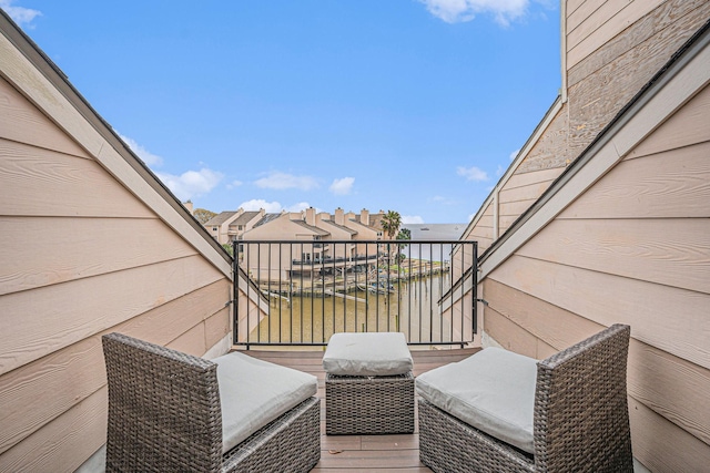 balcony featuring a water view and area for grilling