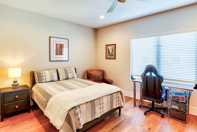 bedroom featuring ceiling fan, light wood finished floors, recessed lighting, and baseboards