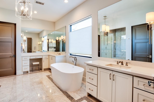 bathroom with a freestanding tub, a notable chandelier, vanity, visible vents, and marble finish floor