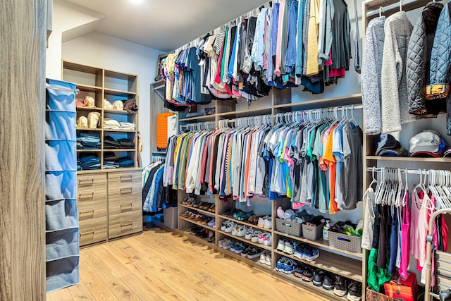 spacious closet with wood finished floors