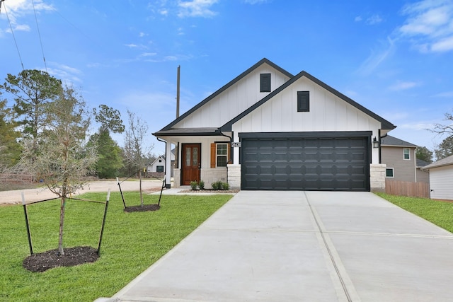 view of front of house with a garage and a front lawn