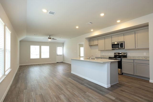 kitchen featuring visible vents, recessed lighting, gray cabinets, appliances with stainless steel finishes, and a sink