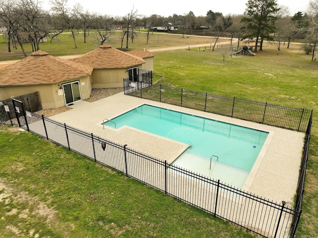 view of swimming pool with a fenced in pool, a patio, a yard, and fence